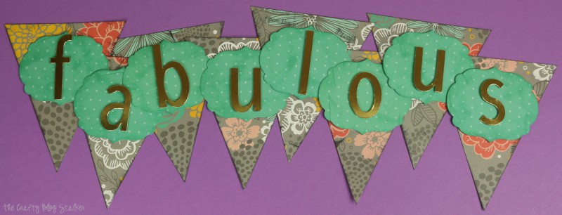 Create a fun and fabulous pennant banner using Jen Hadfield Home + Made papers and accessories. Paper crafts make great home decor!