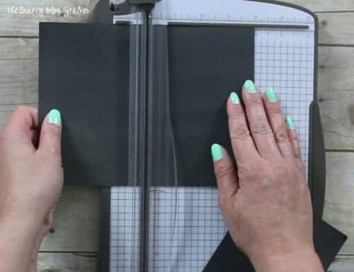 cutting the chalkboard paper with a paper trimmer