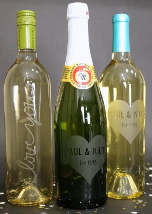 three Personalized Etched Glass Wine Bottles