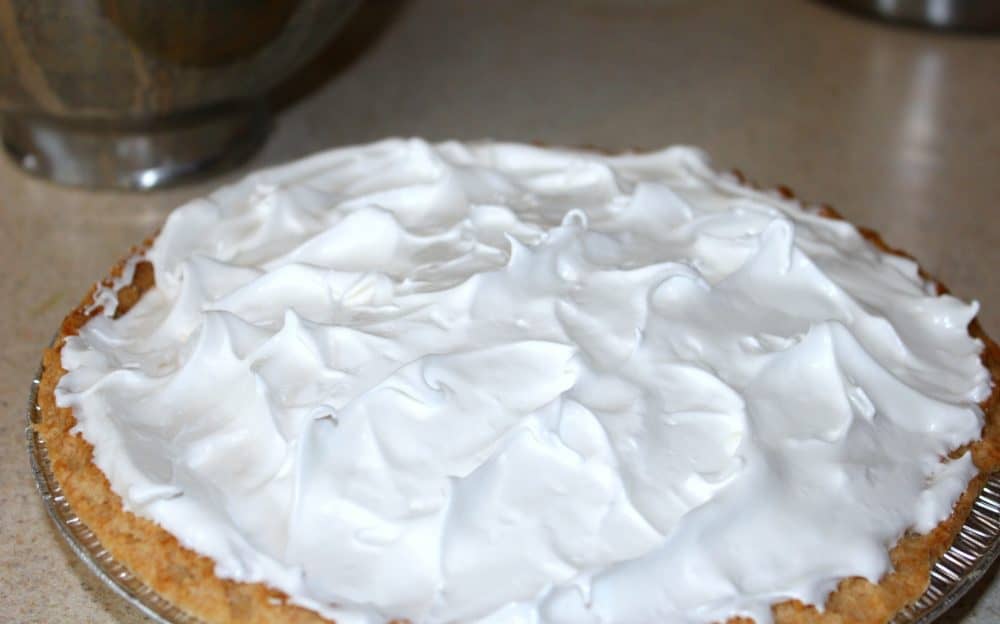 meringue on a lemon pie before it is baked