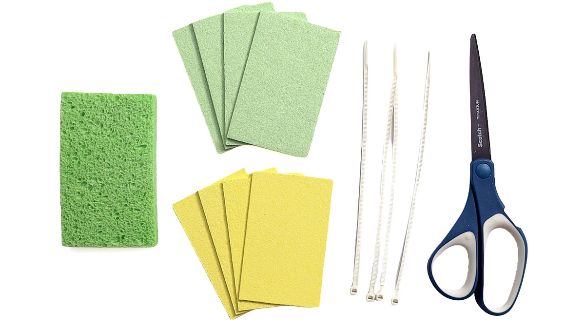Supplies for DIY sponge water bombs including green and yellow sponges, zip ties, and scissors arranged on a white background.