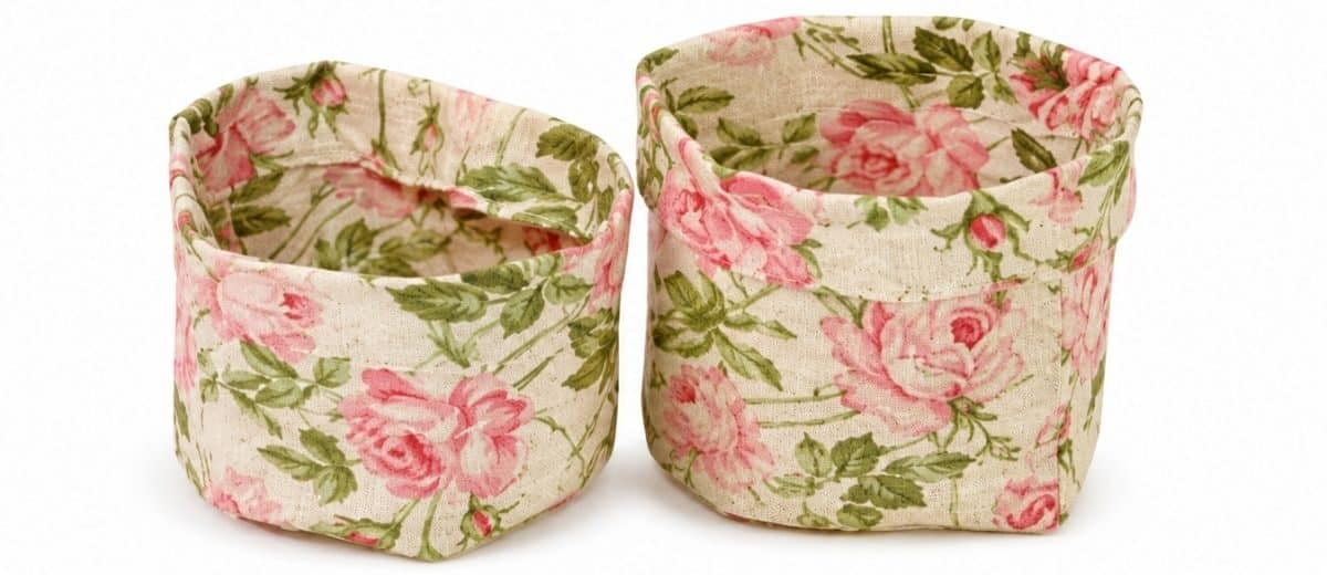 Two floral fabric teacup layers nested together, showing the outer cup and lining assembled before final sewing and finishing.