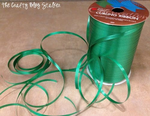 a roll of green curling ribbon