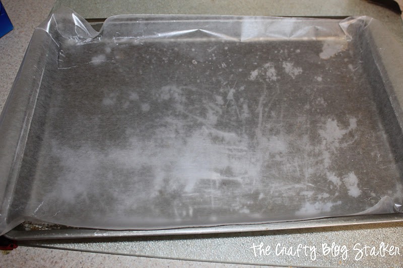 A cookie sheet covered with wax paper.