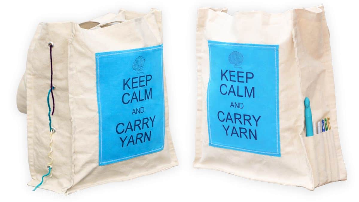Canvas crochet tote bag with blue panel reading Keep Calm and Carry Yarn, shown with yarn thread, crochet hooks, and pockets for supplies.