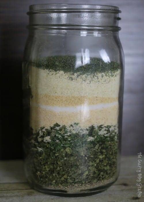 ingredients for ranch dry mix layered in a mason jar.