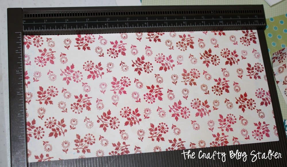 A strip of flowered patterned paper on a score board.