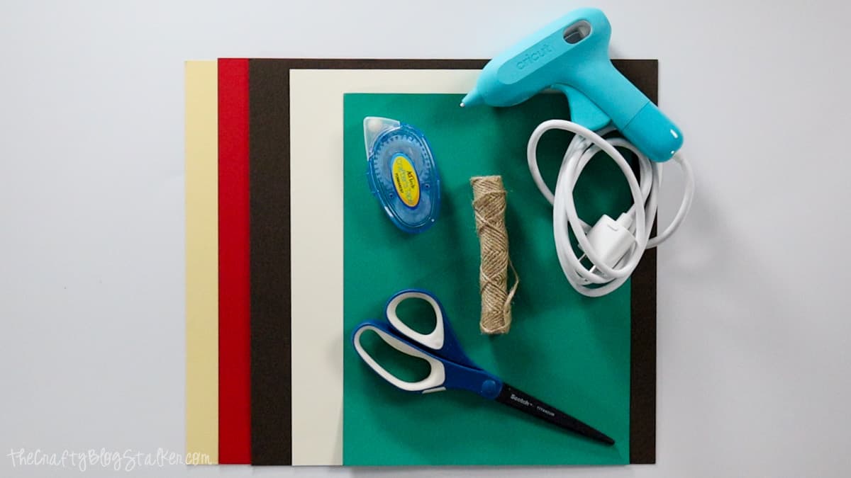 Supplies used: cardstock, glue gun, twine, scissors, and adhesive.
