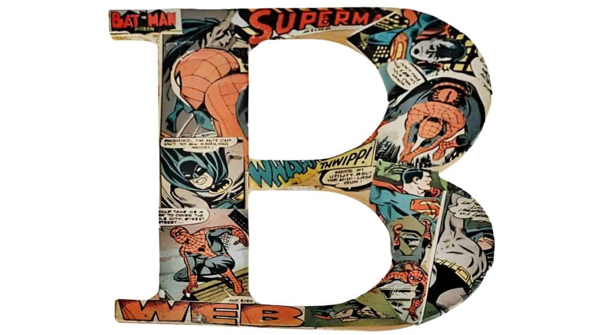 Decorative letter B covered in comic book pages featuring superhero illustrations, displayed on a white background.