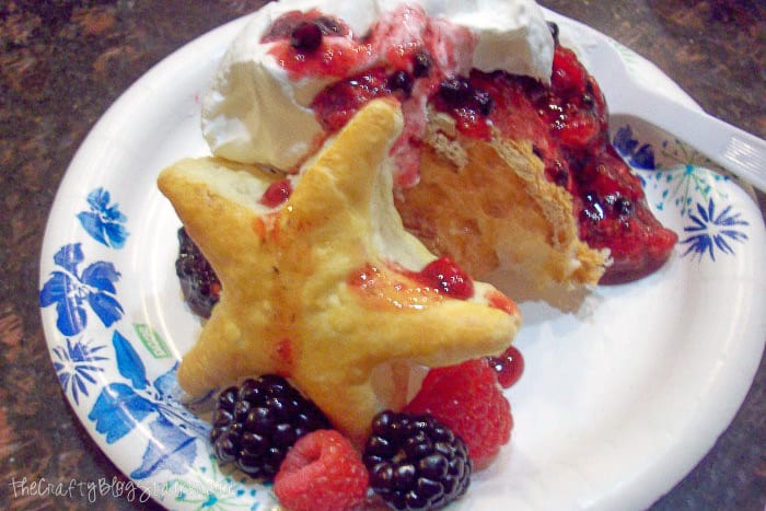 mixed berry patriotic dessert on a paper plate