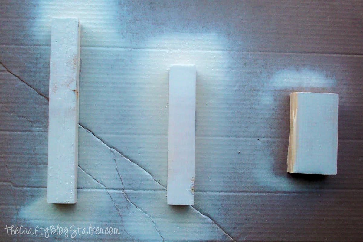 pieces of wood spray painted white