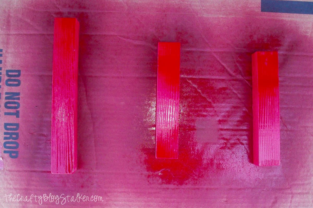 pieces of wood spray painted red
