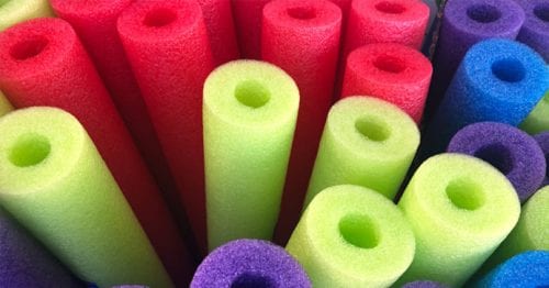 image of red, green, blue and purple pool noodles