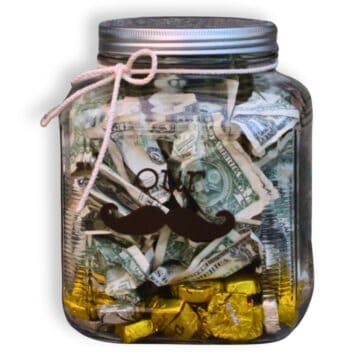 Money jar with vinyl that reads "our Stache" to give as a wedding gift.