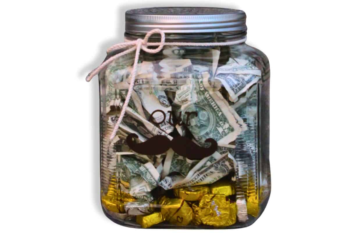 Money jar with vinyl that reads "our Stache" to give as a wedding gift.