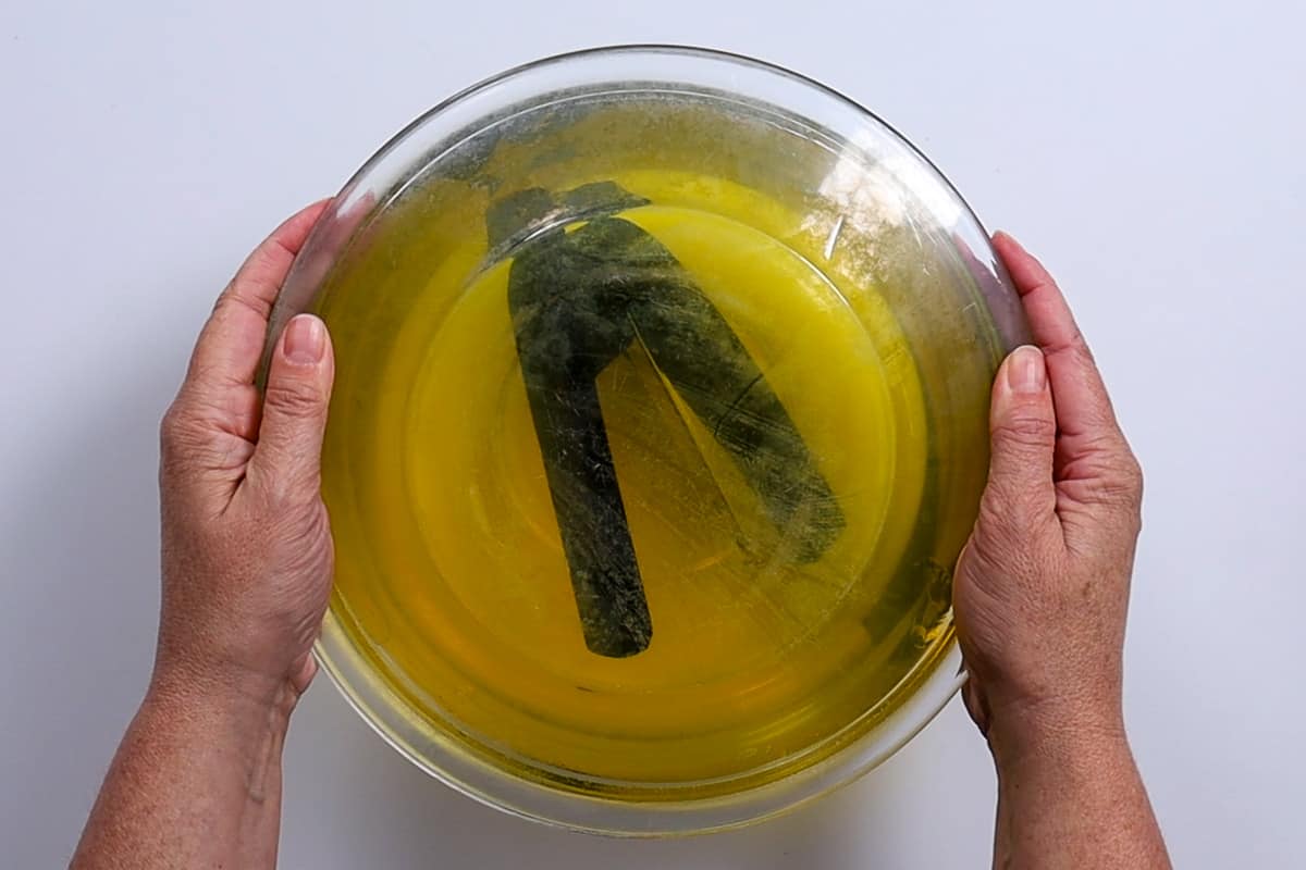 A glass plate on top of the bowl of jello.
