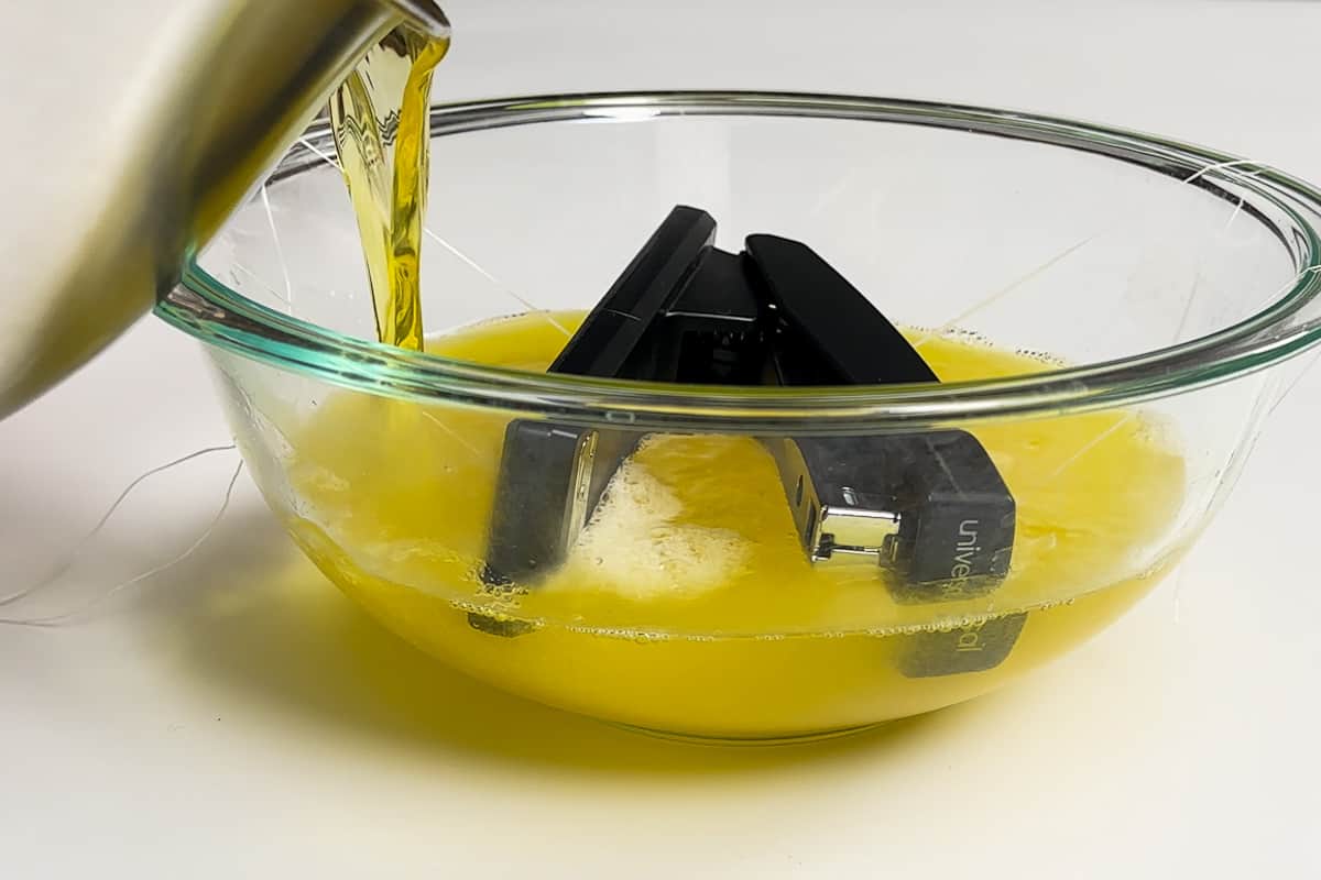 Pouring hot jello mixture into the bowl with the stapler.