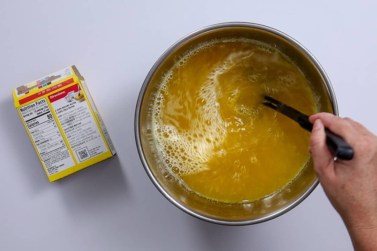 Stirring hot jello mixture.