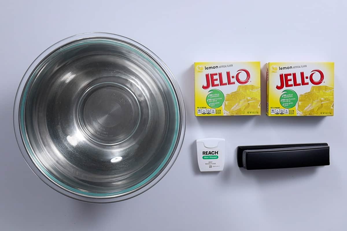 Two mixing bowls, 2 boxes of jello, a stapler, and dental floss.