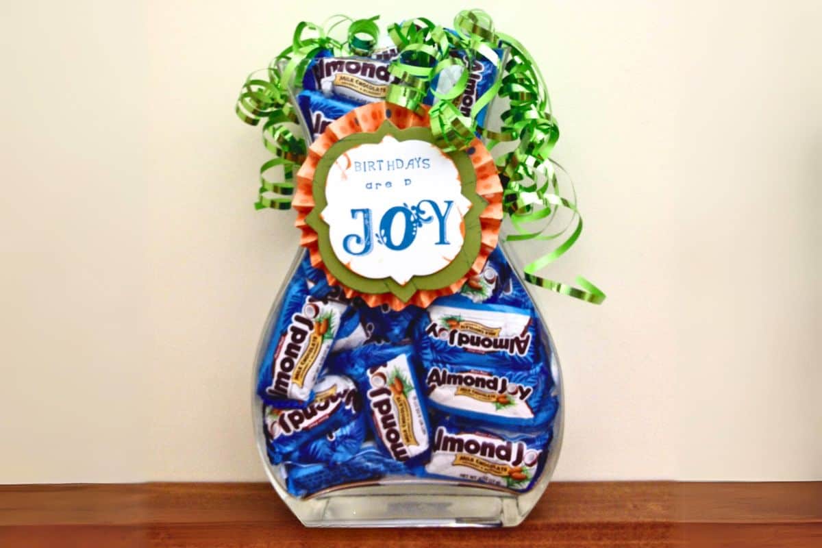 Birthday Candy jar, a glass vase filled with Almond Joy candy bars.