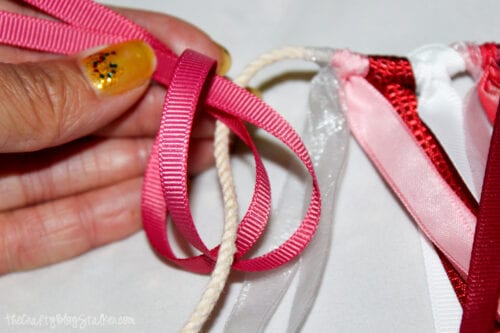 tying on ribbon to a rope