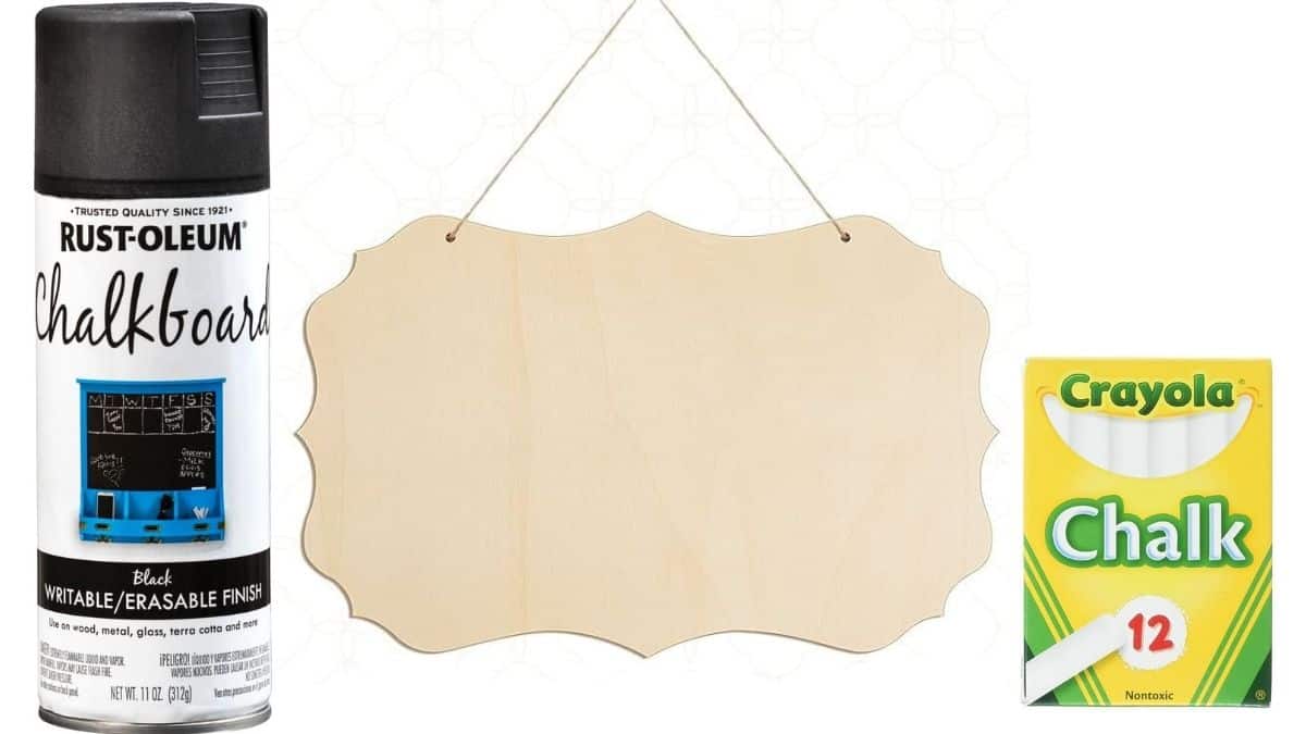 Supplies for a DIY back-to-school chalkboard sign, including chalkboard spray paint, a blank wood sign, and white chalk.