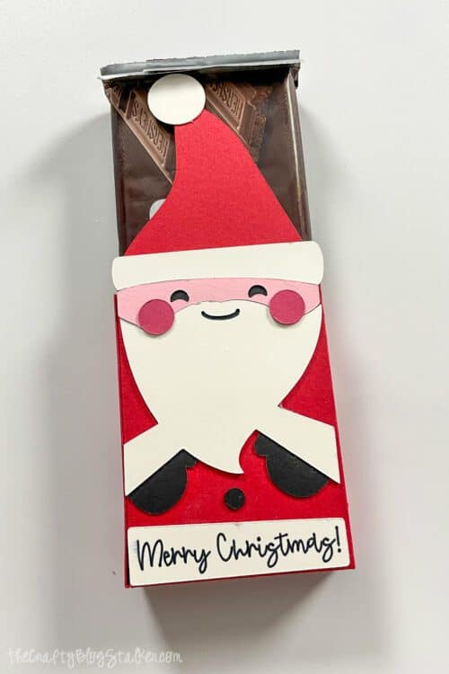 Santa box holding candy bars