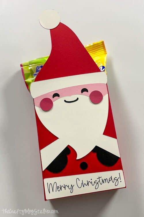 Santa box holding a small bag of candy