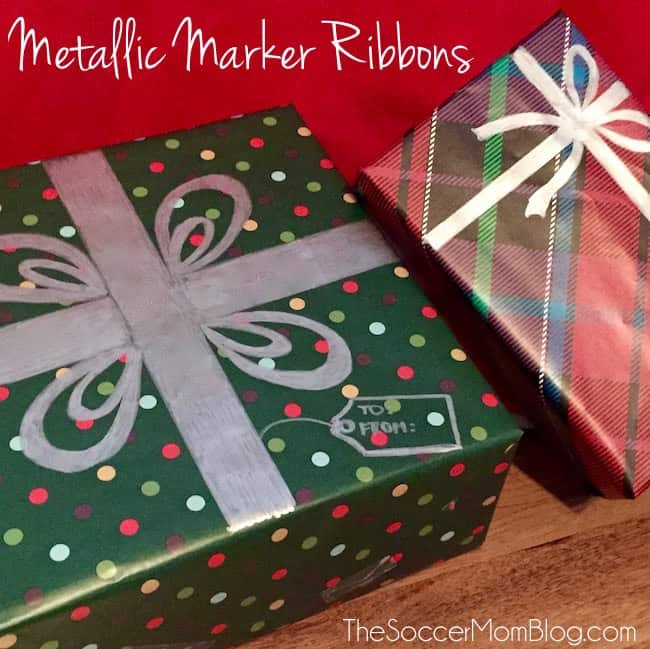 Christmas gifts wrapped in patterned paper with metallic marker ribbons and bows drawn directly onto the packages.