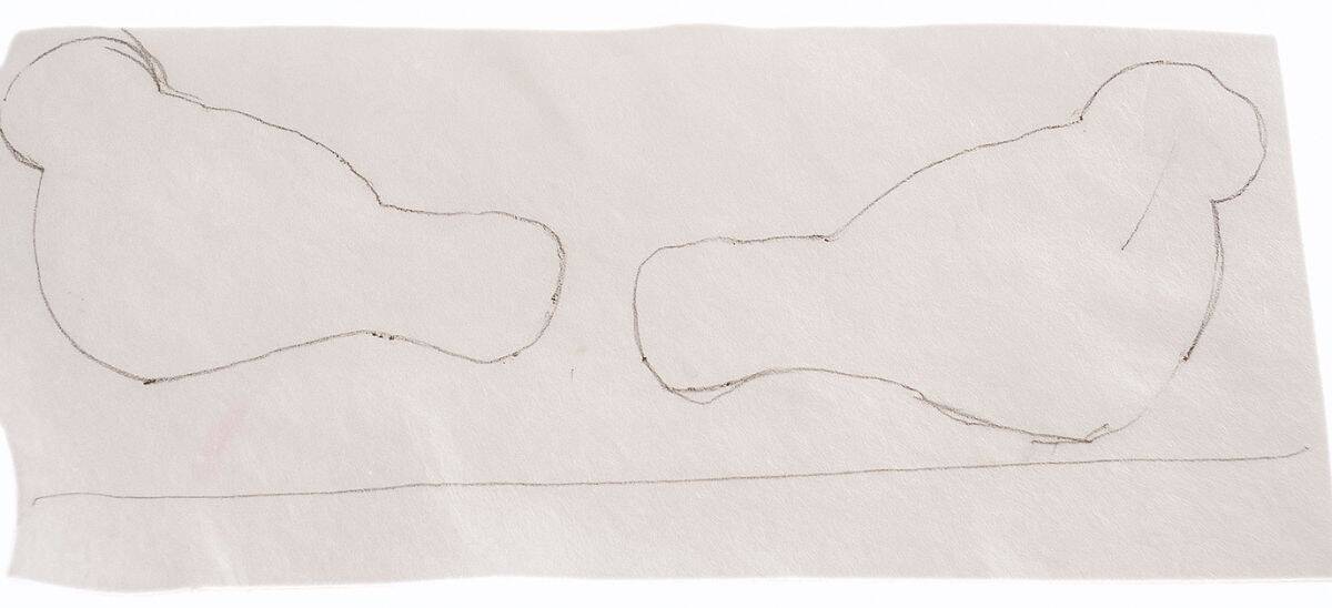 Two bird shapes hand-drawn on a piece of white felt, ready to be cut out for a craft project.