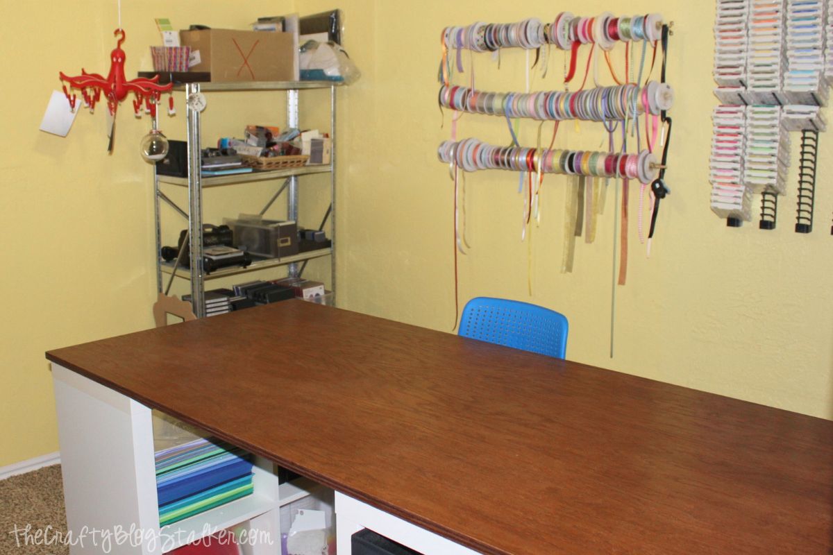How to make a custom craft table using Ikea Kallax shelves and a tabletop. This is a DIY table that you can make for your craft room.