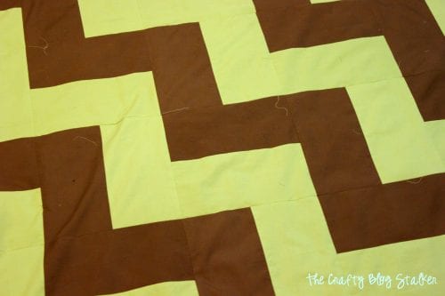 finished quilt top of green and brown chevron duvet