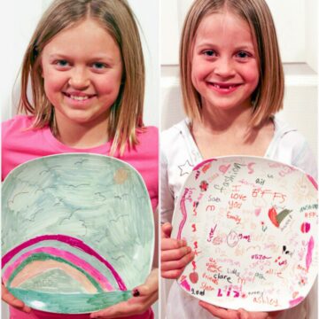 Two kids holding their baked sharpie plates.
