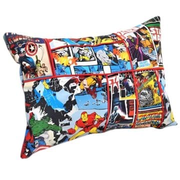 Rectangular pillow with a patchwork design of Marvel and Star Wars comic book prints, featuring superheroes like Iron Man, Batman, and Captain America.