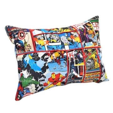 Rectangular pillow with a patchwork design of Marvel and Star Wars comic book prints, featuring superheroes like Iron Man, Batman, and Captain America.