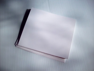 a stack of white cardstock rectangles