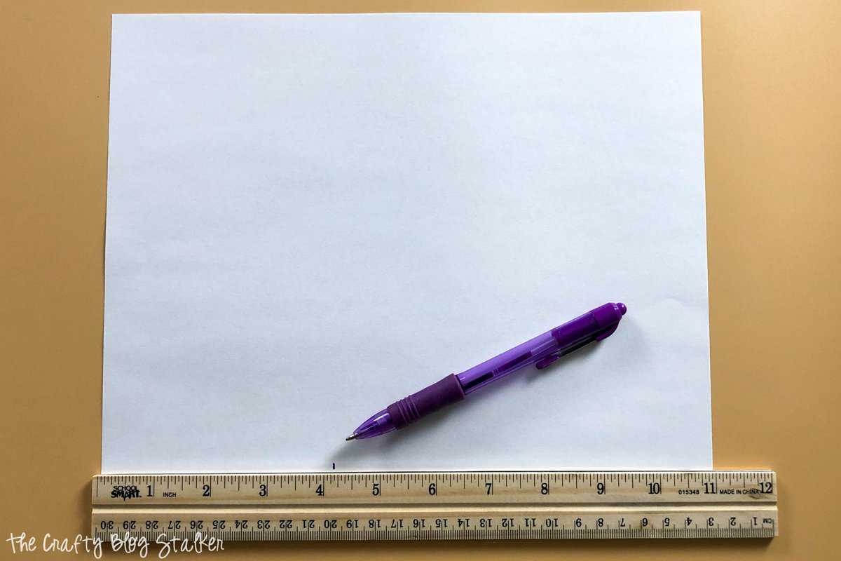 image of creating a pattern with a pen, ruler, and piece of paper