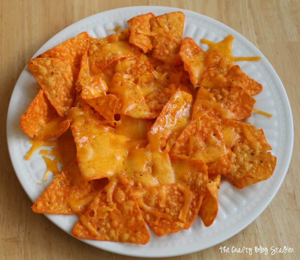 image of melted shredded cheese on a plate of doritos
