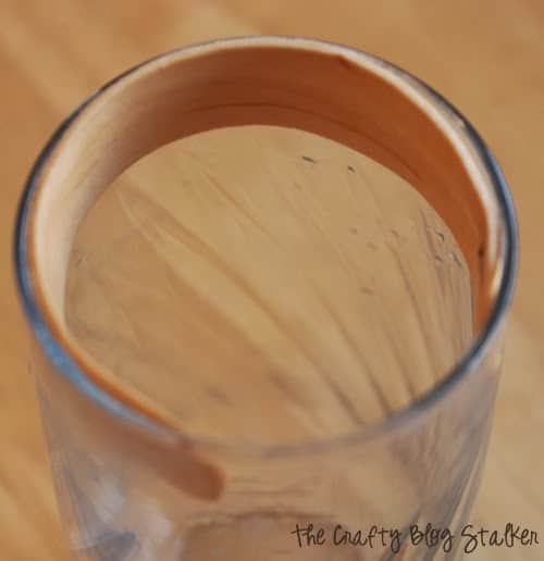 shaping the napkin ring in a drinking glass