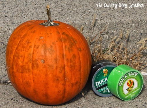 pumpkin with black and green duct tape