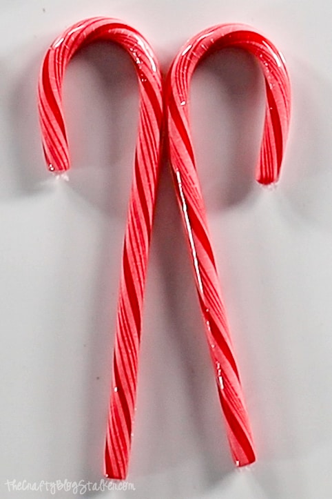 two candy canes, back to back