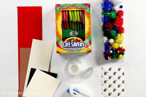 scrap paper, candy canes, pom-poms, tape, double sided adhesive and glue dots