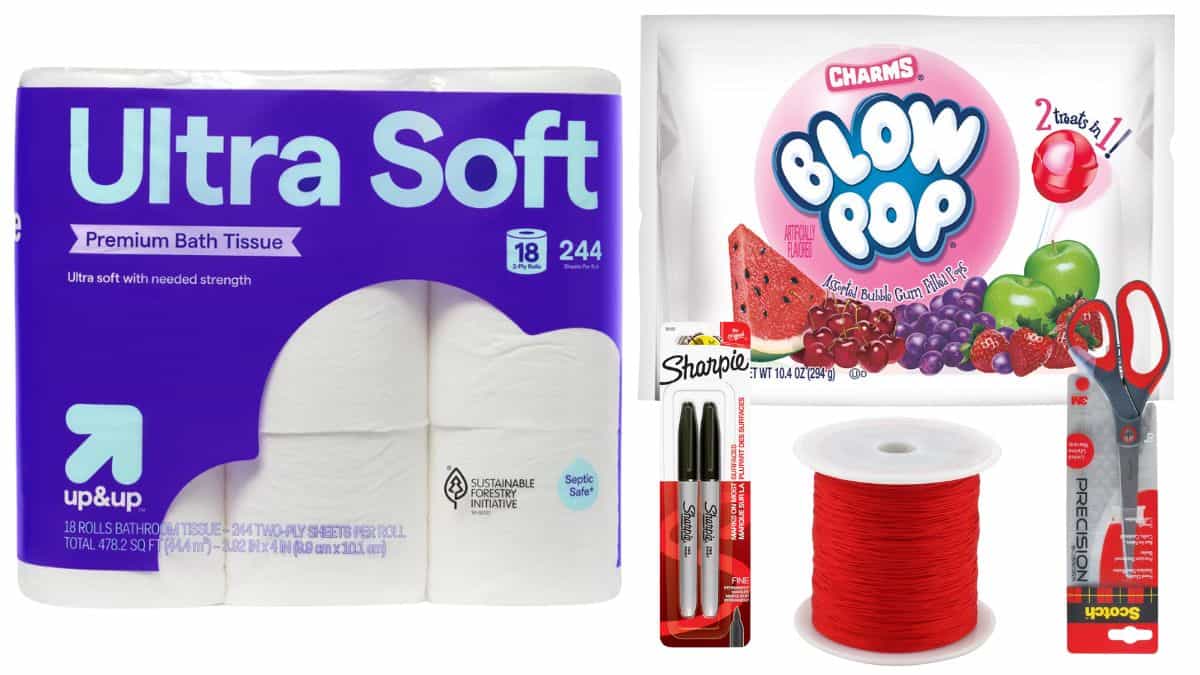 Supplies for making ghost lollipops including toilet paper, Blow Pops, black Sharpies, red string, and scissors.