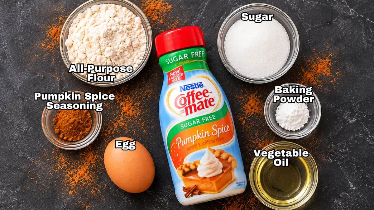 Ingredients for pumpkin spice mug cake: flour, sugar, pumpkin spice creamer, seasoning, egg, baking powder, and vegetable oil.