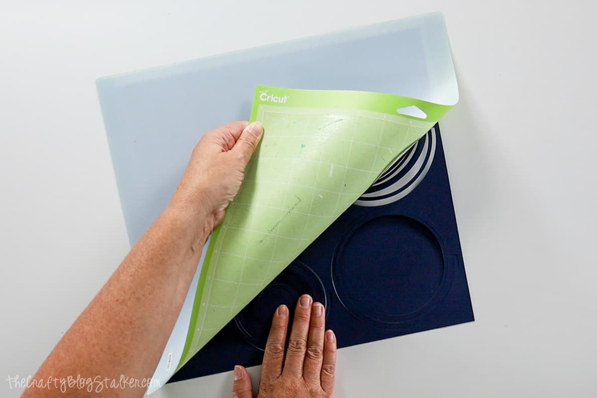 Removing paper spirals from cutting mat.
