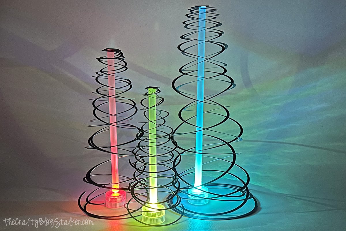 Lit up spiral paper Christmas trees.