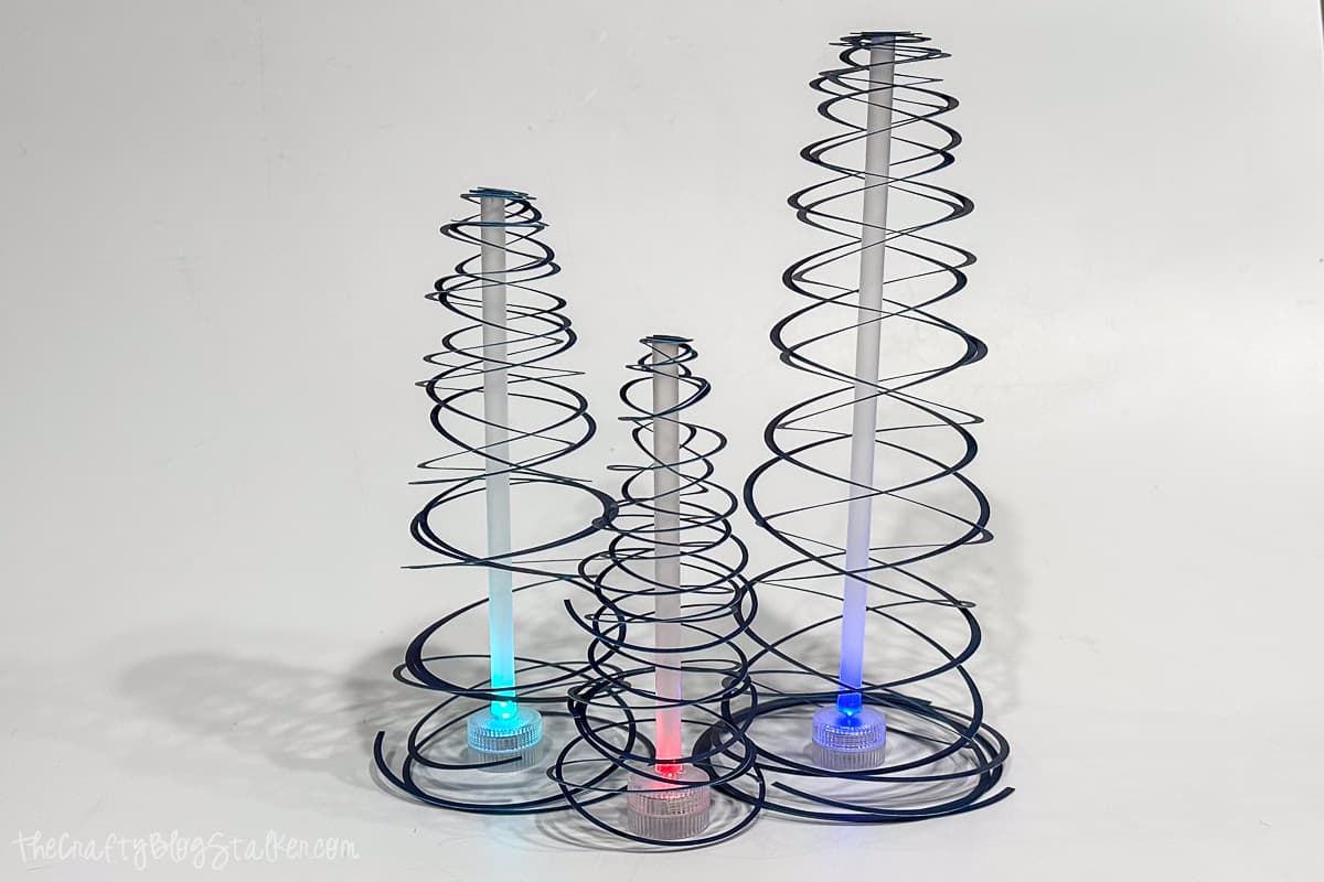 A trio of spiral paper Christmas trees that light up!