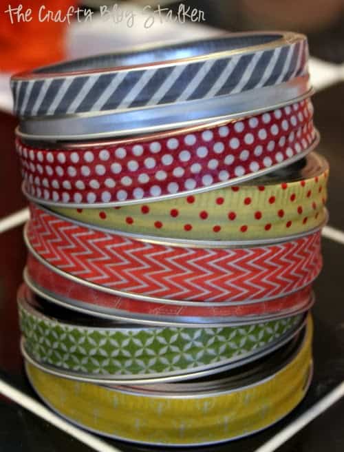 Create a Canning Lid Wreath out of Mason Jar Lids and Washi Tape. An easy DIY craft tutorial idea that can be made to match any season.