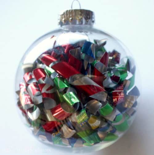 Handmade Christmas ornament with soda cans inside.