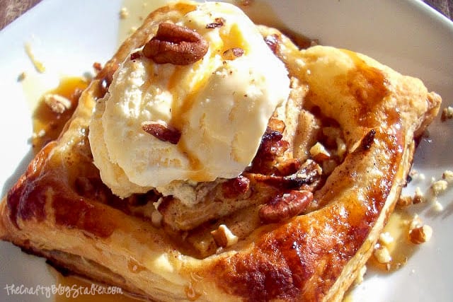 Apple pecan pastry on a white plate.